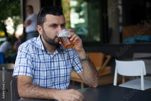 Handsome man drinking beer