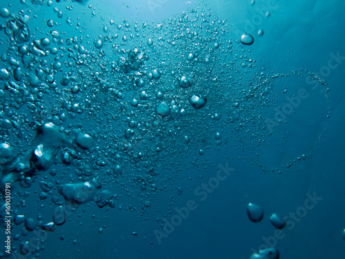 Bubbles in clear blue water