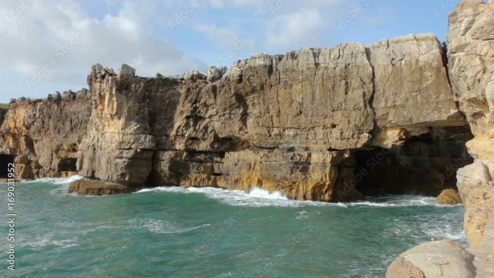 Caves into cliff rocks, Devils Mouth, Lisbon, Portugal Caves into cliff rocks, Devils Mouth, Lisbon, Portugal
