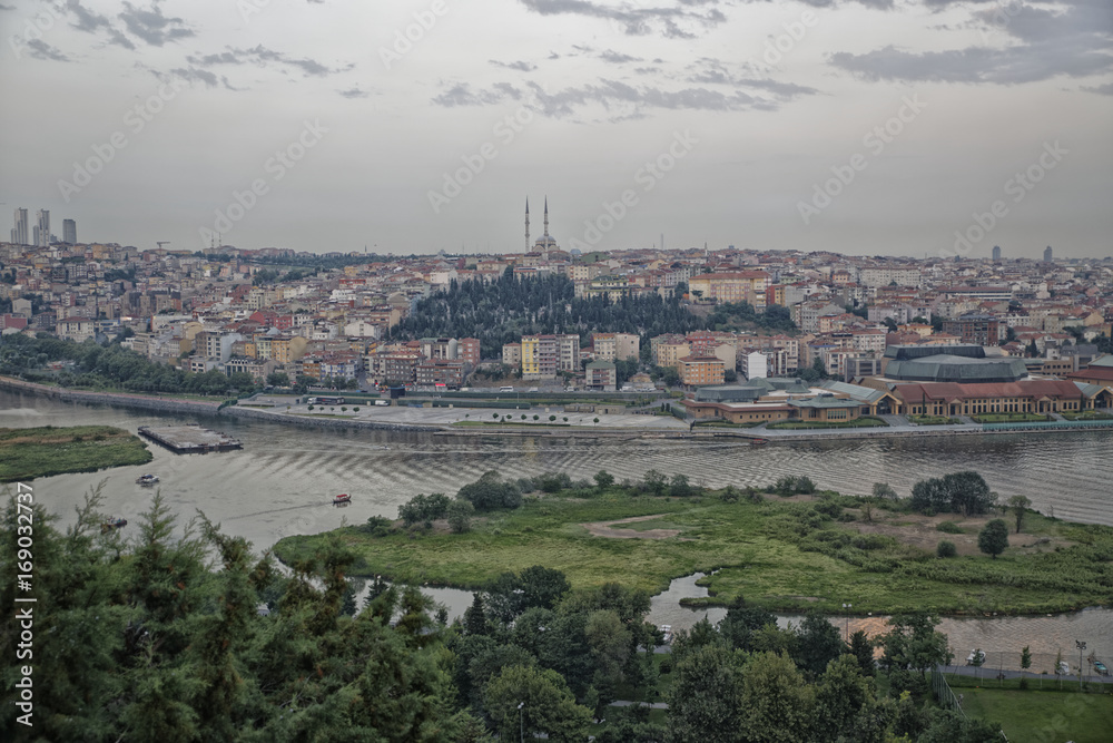 Istanbul (Turkey) panoramic daylight view from Pier Loti hill with clouds in sky in background	