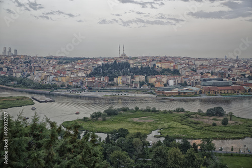 Istanbul (Turkey) panoramic daylight view from Pier Loti hill with clouds in sky in background 