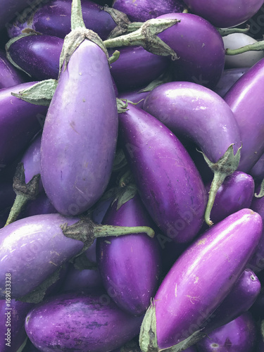 Organic eggplants for sale at farmers market photo