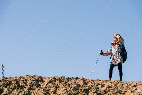 Young girl traveling on a desert photo
