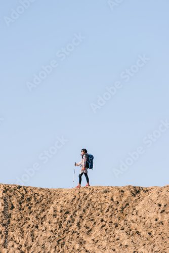 Young girl traveling on a desert photo