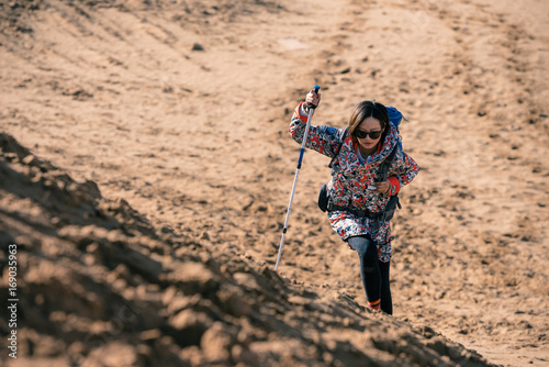 Young girl traveling on a desert photo