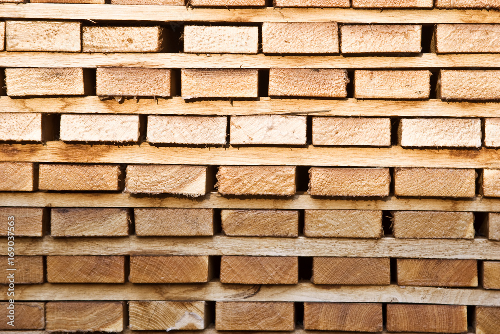 Background from the boards at a sawmill close-up Background from the boards at a sawmill close-up