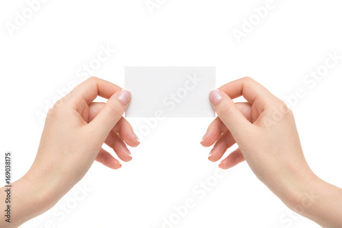 Isolated female hands hold white card on a white background.