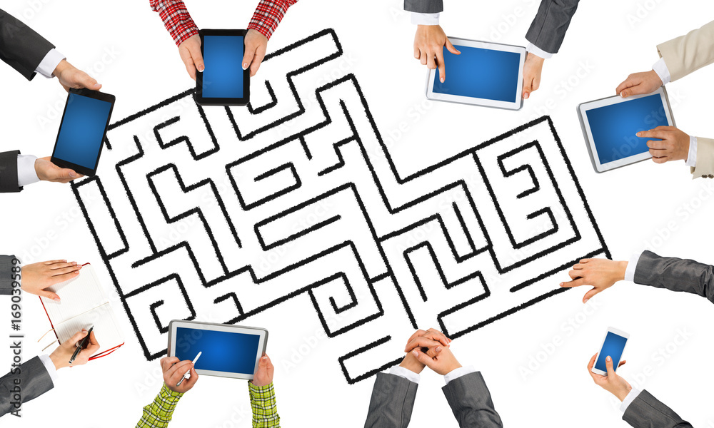 Top view of businesspeople sitting at table and using gadgets Top view of businesspeople sitting at table and using gadgets
