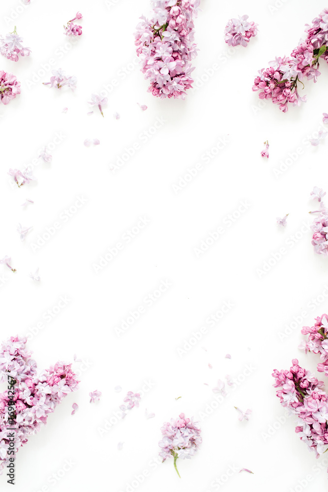 Frame of lilac flowers with space for text on white background. Flat lay, top view Frame of lilac flowers with space for text on white background. Flat lay, top view