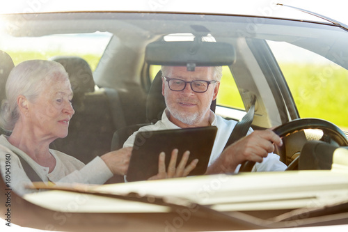 happy senior couple with tablet pc driving in car © Syda Productions
