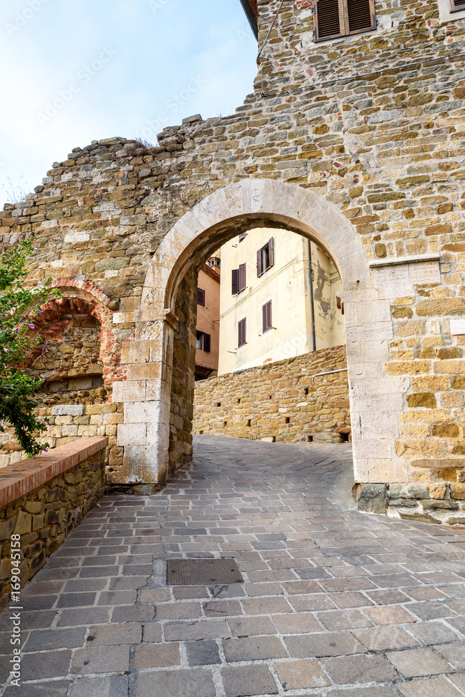 ancient gate (porta pisana, 1326) in the village of Scarlino, tuscany, italy