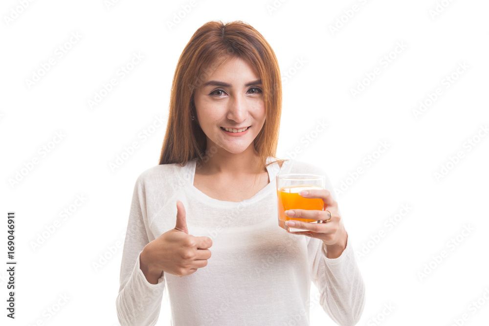 Young Asian woman thumbs up drink orange juice. Young Asian woman thumbs up drink orange juice.