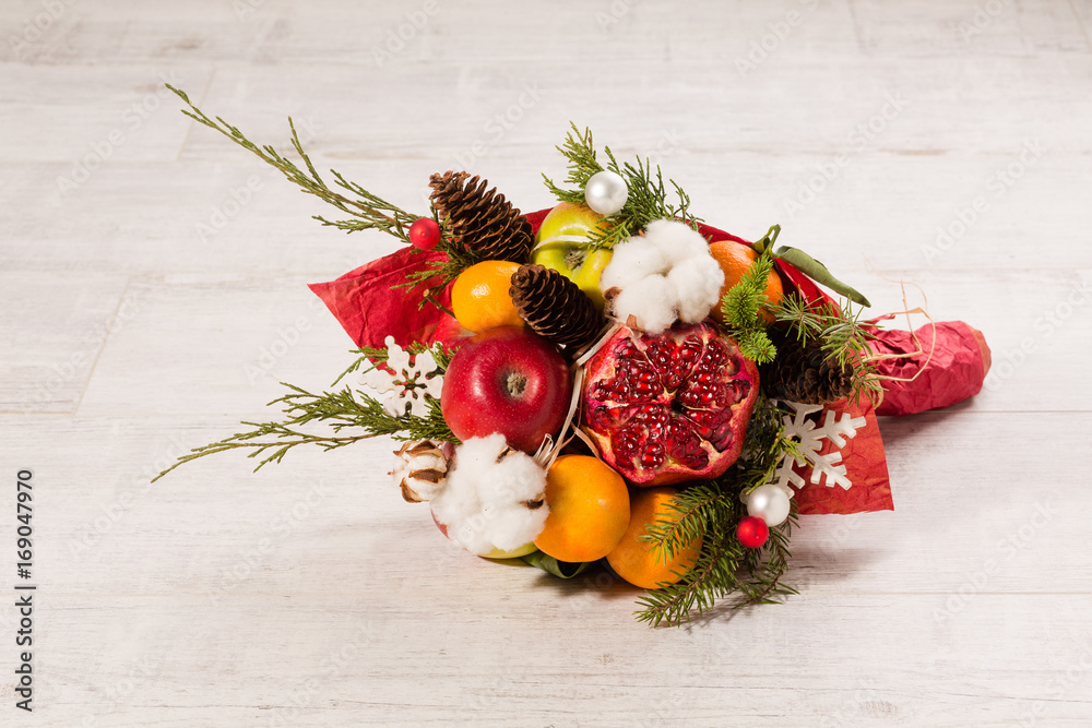Close up view of winter edible bouquet. Unusual bucket of fruits and plants. Close up view of winter edible bouquet. Unusual bucket of fruits and plants.