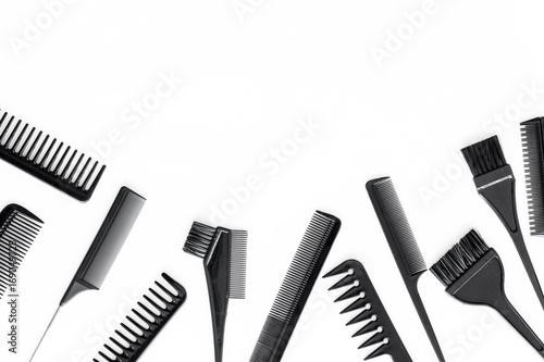 combs and hairdresser tools on white work desk background top view mockup
