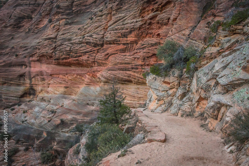 Sandy Trail Along Red Rock Cliff