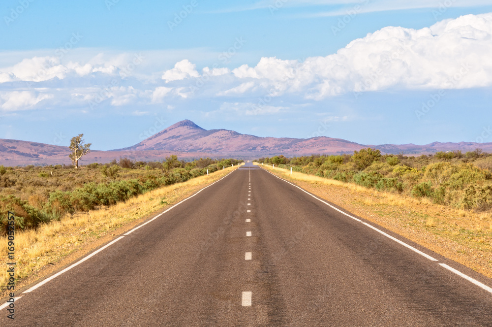Straight road towards the Flinders Ranges, SA, Australia Straight road towards the Flinders Ranges, SA, Australia