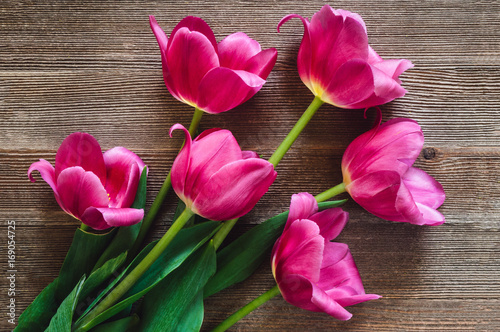 Fototapeta Naklejka Na Ścianę i Meble -  Pink Tulips on Rustic Wooden Table