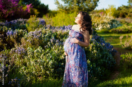 Pregnancy Pregnant woman in the garden photo