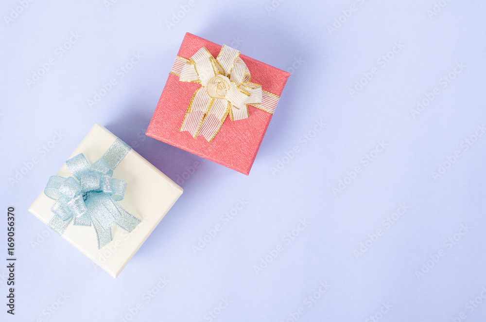 Gift box on light blue background for giving in holidays Gift box on light blue background for giving in holidays