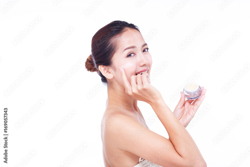 Close up Asian women Are happy Between skin care and her face. With skin cream and skin spa. skin care and spa concept. Close up Asian women Are happy Between skin care and her face. With skin cream and skin spa. skin care and spa concept.