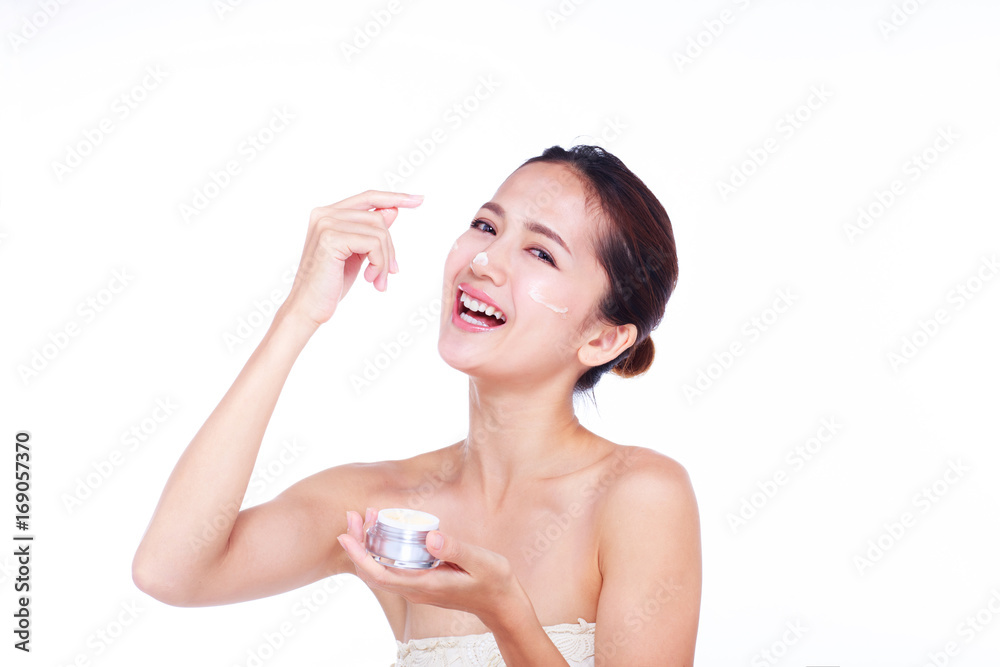 Close up Asian women Are happy Between skin care and her face. With skin cream and skin spa. skin care and spa concept. Close up Asian women Are happy Between skin care and her face. With skin cream and skin spa. skin care and spa concept.
