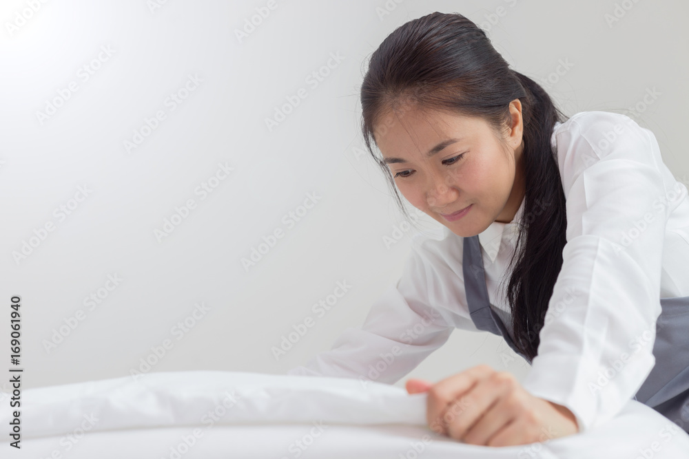 Beautiful asian maid cleaning blanket in bedroom Beautiful asian maid cleaning blanket in bedroom