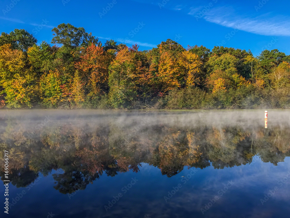 Fog on Mirror Lake separating the horizon from the reflection