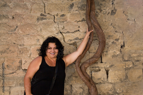 Woman at the wall of the old city