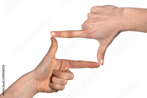 Woman hands making frame gesture isolated on white background with copy space photo