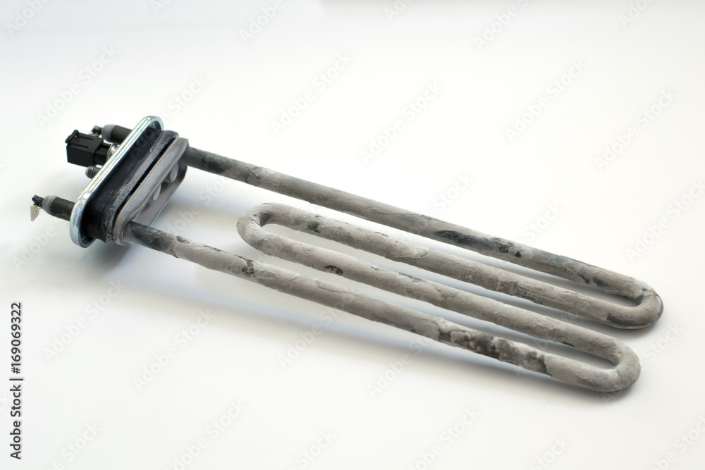 Washing machine heater with scum on a white background Washing machine heater with scum on a white background