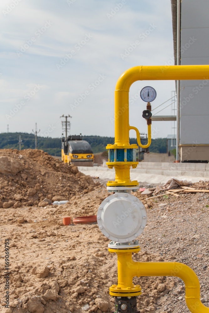 Yellow gas pipeline at construction site. Construction of a new road. Gas distribution. Yellow gas pipeline at construction site. Construction of a new road. Gas distribution.