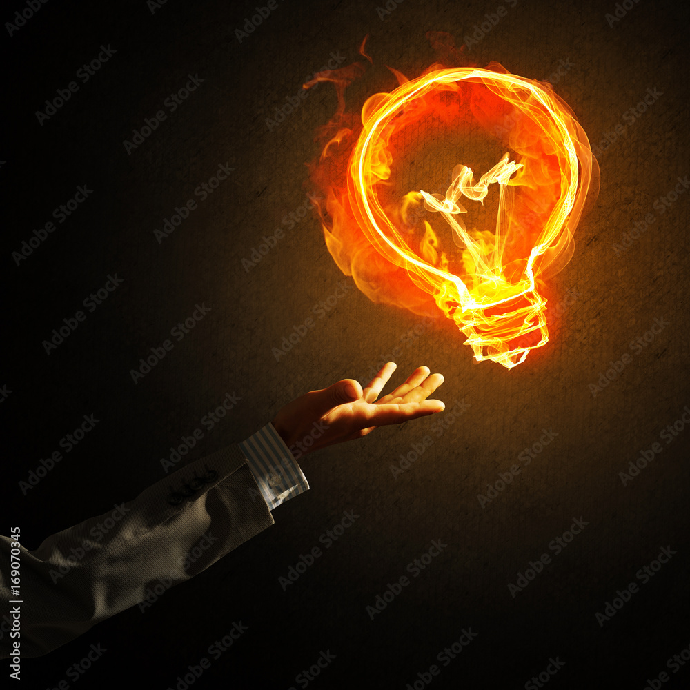 Concept of electricity or inspiration with burning light bulb