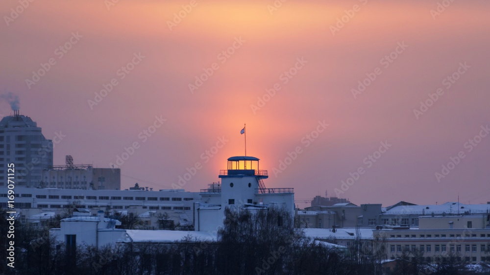 the sun shines through the tower structure in the winter in Ekaterinburg