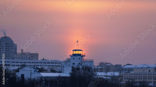 the sun shines through the tower structure in the winter in Ekaterinburg