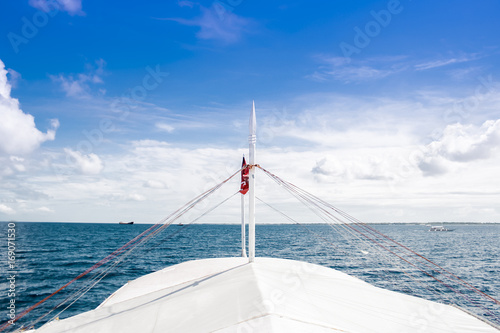 Sailing boat bow on the ocean