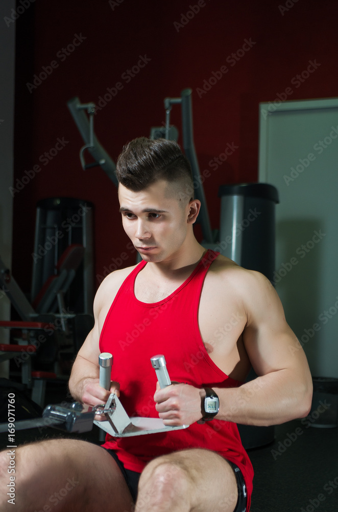 Fototapeta premium The guy is in the gym