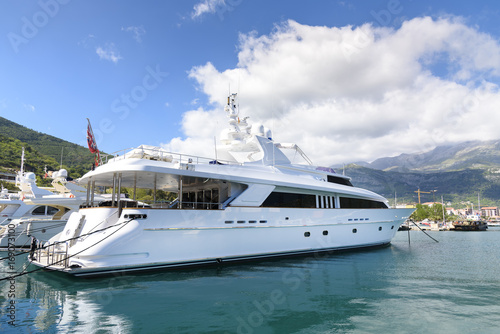 luxurious white yacht parking at the port © wayfarerlife