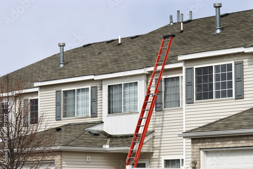 Ladder extending to roof for repairs