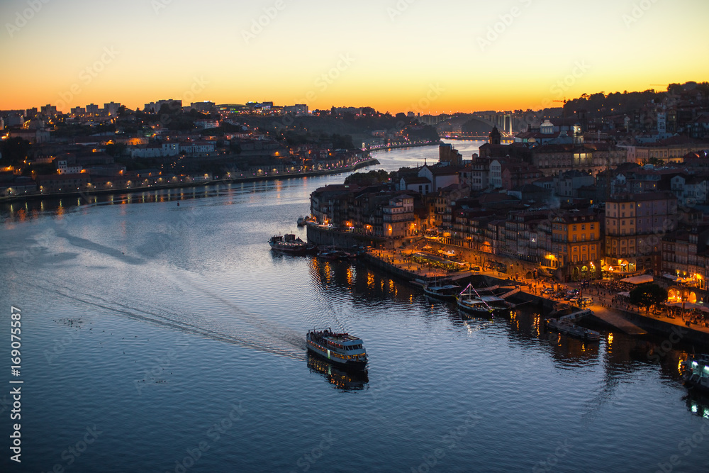 Douro river and Ribeira from Dom Luis I bridge at night time, Porto, Portugal.