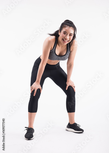 tired young fitness woman after Squat exercise on white background © Ratthaphon Bunmi