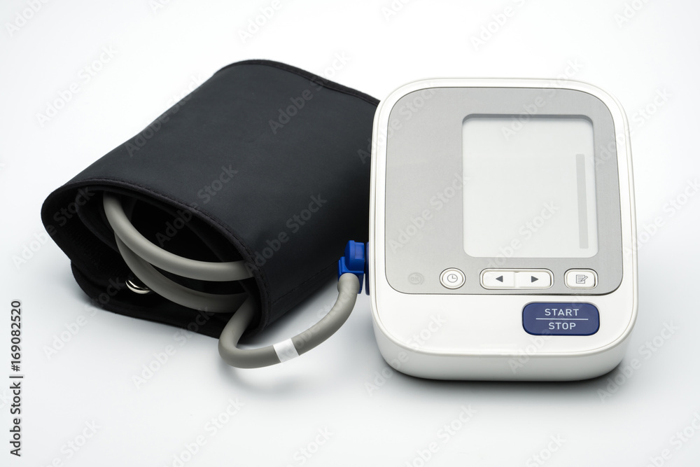 Automatic blood pressure monitor with wide range cuff on white background with copy space Automatic blood pressure monitor with wide range cuff on white background with copy space