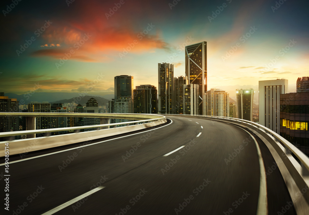 Highway overpass motion blur with city background .