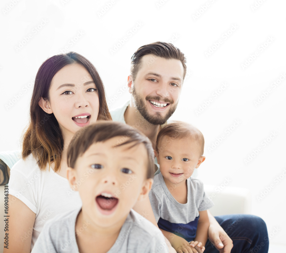 close up mixed race family in living room. close up mixed race family in living room.