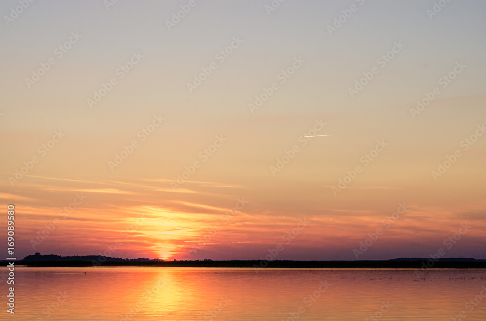 Sunset on the lake. Sunset in the water. Sunset on the lake. Sunset in the water.