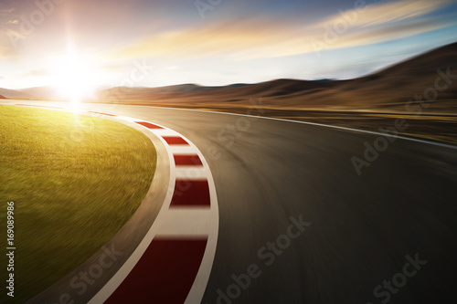 Motion blurred racetrack with mountain background , warm mood © jamesteohart