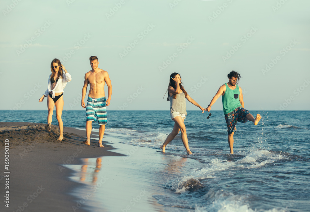 Group of friends together on the beach having fun. Group of friends together on the beach having fun.