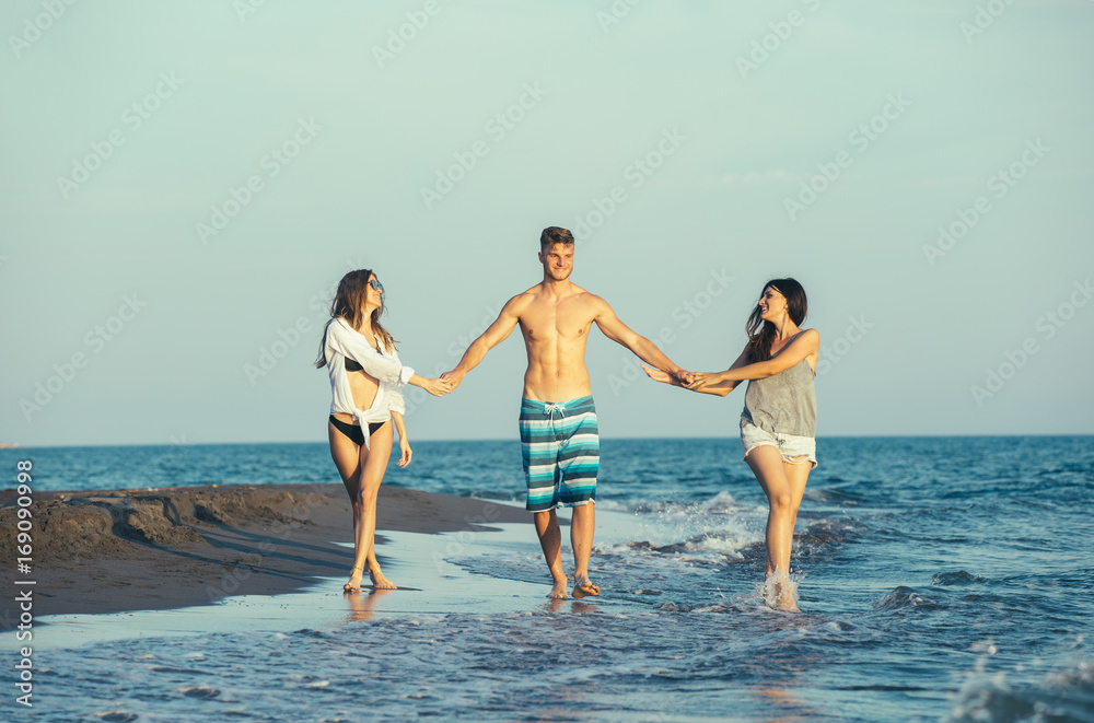 Group of friends together on the beach having fun. Group of friends together on the beach having fun.