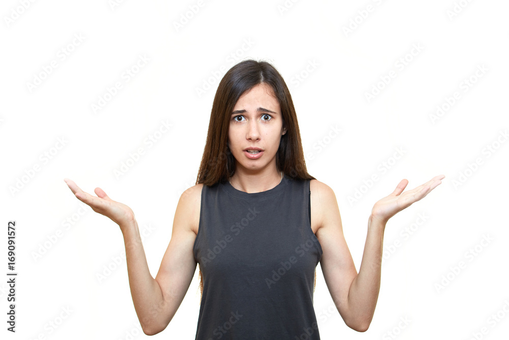 Indoor shot of cute girl looking away having doubtful and indecisive face expression. Girl emotions. White background. Indoor shot of cute girl looking away having doubtful and indecisive face expression. Girl emotions. White background.