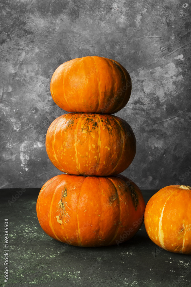 Ripe pumpkins on a green background Ripe pumpkins on a green background