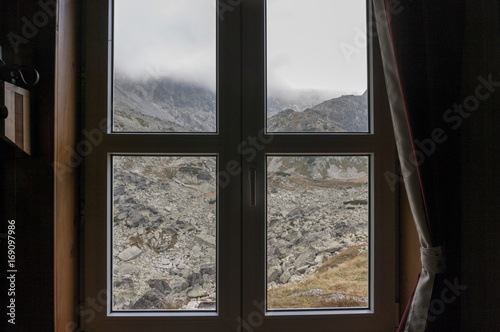 Window with a view of the mountains